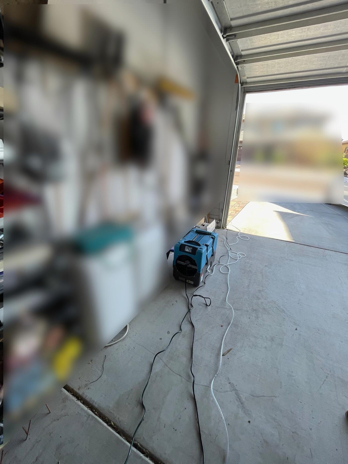 Drying equipment staged in the affected garage.